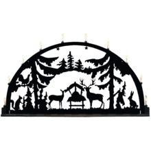 Schwarzer Schwibbogen mit Waldtiermotiven und Kerzen