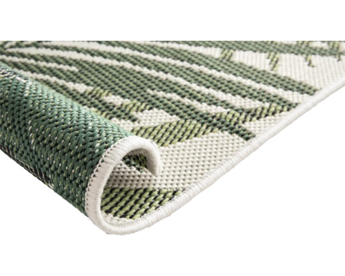 Detailansicht eines Teppichs mit Pflanzenmuster