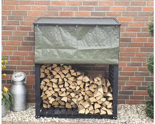 Kaminholzunterstand promadino Speyer inkl. Wetterschutz 119,5 x 68 x 148 cm anthrazit Holzlager mit Plane und Holz vor einer Ziegelwand