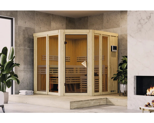 Elementsauna Karibu Sairi inkl. 9 kW u.ext.Steuerung mit Dachkranz und bronzierter Ganzglastür Ecksauna mit Holzbänken und Glastür in einem hellen Raum