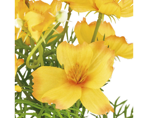 Künstliche gelbe Blumen mit grünen Blättern