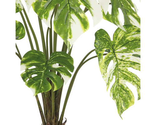 Künstliche Monstera Pflanze mit grünen Blättern