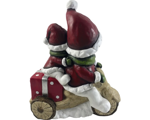 Weihnachtsdekoration mit zwei Wichteln auf einem Motorrad mit Geschenk