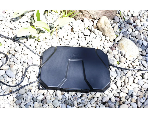 Heissner Logo. Schwarzer Heissner Transformator auf Kies