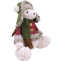 Dekorative Plüschfigur eines sitzenden Lamms mit Mütze und Schal