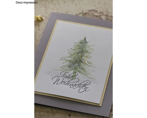 Dekorative Weihnachtskarte mit Tannenbaum und dem Schriftzug Frohe Weihnachten.