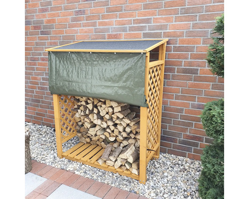 Kaminholzunterstand promadino Speyer inkl. Wetterschutz 119,5 x 68 x 148 cm imprägniert Holzlager mit Holz und Abdeckplane vor einer Ziegelwand