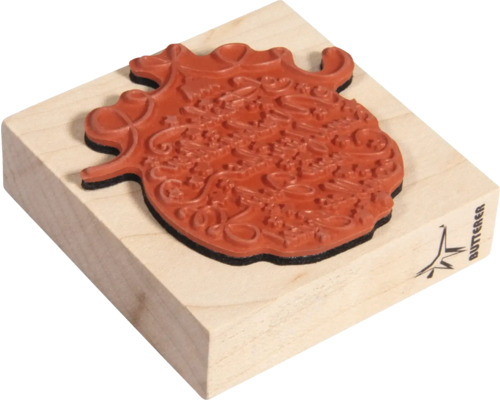 Stempel mit Motiv auf Holzblock