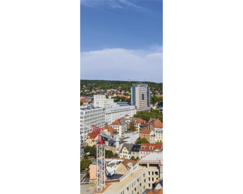 Duschrückwand SCHULTE DecoDesign Jena Tower links 255 x 100 cm D190102523 8139 Panoramaaufnahme einer Stadt mit verschiedenen Gebäuden und einem Baukran.