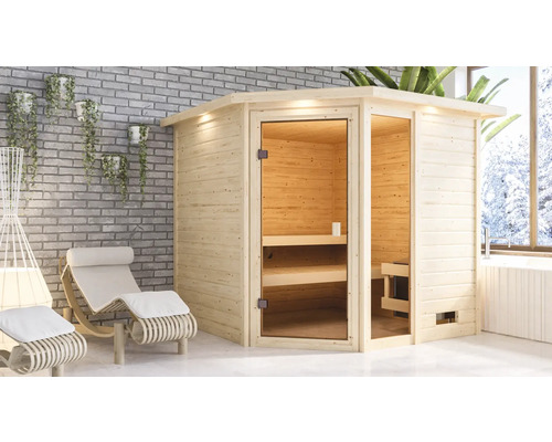 Massivholzsauna Karibu Tabea inkl.9 kW Ofen u.ext.Steuerung mit Dachkranz und bronzierter Ganzglastüre Holzsauna mit Glastür und Liegen in einem hellen Raum