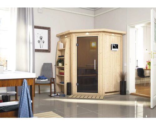 Elementsauna Karibu Callinan inkl. 9 kW Ofen u.ext.Steuerung mit Dachkranz und graphitfarbeneer Ganzglastüre Holzsauna mit Glastür in einem hellen Badezimmer.