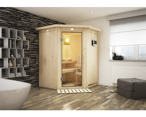 Plug & Play Sauna Karibu Achat II inkl. 3,6 kW Ofen u.ext.Steuerung mit Dachkranz und Ganzglastüre aus Klarglas Ecksauna aus Holz mit Glastür in einem Badezimmer mit Badewanne und Regal