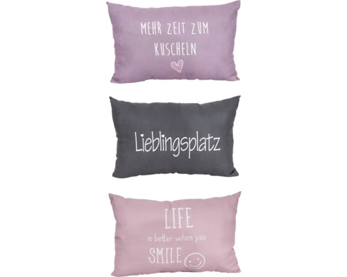 Drei Kissen mit Schriftzügen: Mehr Zeit zum Kuscheln, Lieblingsplatz, Life is better when you smile.