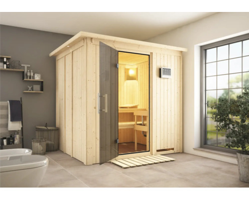 Elementsauna Karibu Sodina inkl. 9 kW Bio Ofen u.ext.Steuerung mit Dachkranz und graphitfarbeneer Ganzglastüre Holzsauna mit Glastür in einem Badezimmer