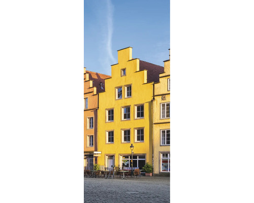 Duschrückwand SCHULTE DecoDesign Osnabrück rechts Gelbes Haus Cafe 255 x 100 cm D190102523 8146 Gelbe Gebäude mit Fenstern und Tischen auf einem Platz