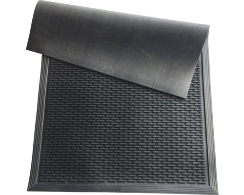 Schwarze Gummimatte mit Drainagelöchern und gerippter Oberfläche