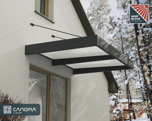 Modernes Vordach mit dunkelgrauem Aluminiumrahmen und Hitzeschutz-Technologie, montiert an einer weißen Hauswand. Canopia by Palram Logo.
