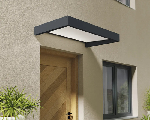 Modernes Vordach in Anthrazit mit weißer Abdeckung über einer hölzernen Haustür an einer verputzten Fassade.