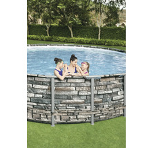 Rundes Aufstellbecken mit Steinwandoptik und badenden Personen