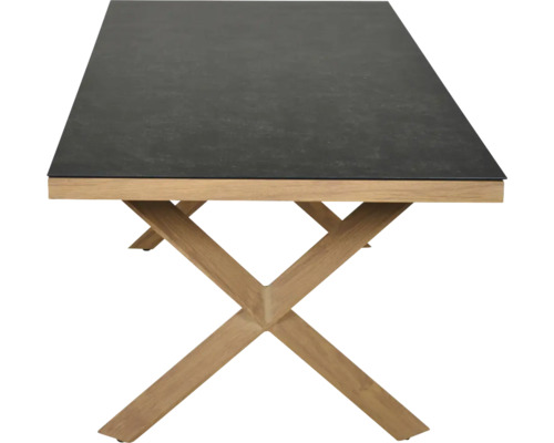 Rechteckiger Tisch mit dunkler Platte in Steinoptik und X-förmigem Gestell aus hellem Holz.