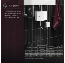Elektronischer Durchlauferhitzer von AEG an dunkler Wand montiert. VDE geprüft.