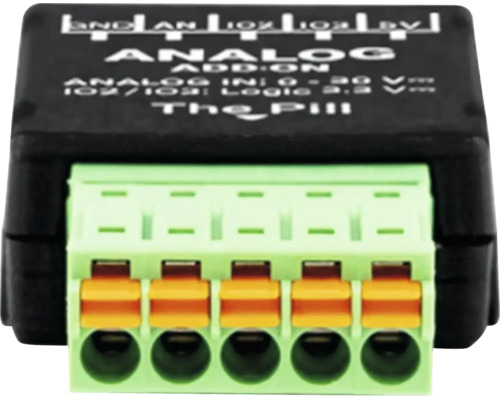 Analog-Zusatzmodul The Pill für Elektroinstallationen mit fünfpoliger Klemmenleiste und orangefarbenen Hebeln.
