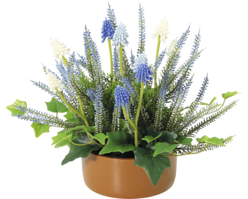 Dekorative Kunstpflanze mit blauen und weißen Blüten in einem Topf