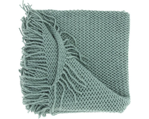 Grob gestrickte grüne Wohndecke mit dekorativen Fransen.