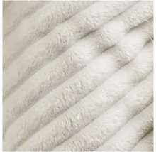 Detailaufnahme einer weichen, flauschigen Stoffoberfläche mit Rippenstruktur.