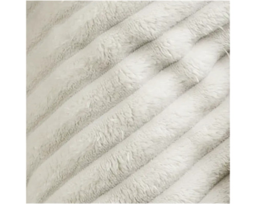 Detailaufnahme einer weichen, flauschigen Stoffoberfläche mit Rippenstruktur.