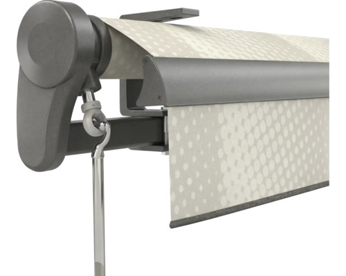 Nahaufnahme einer dunkelgrauen Markisenmechanik mit Kurbelöse und weißem Stoff mit Punktmuster.