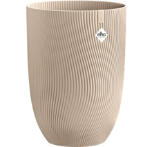 Hoher runder Blumentopf in Beige aus Kunststoff mit gewellter Oberflächenstruktur und Elho Logo.