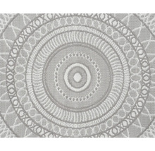 Rundteppich mit kreisförmigem Mandala-Muster und gewebter Oberflächenstruktur.