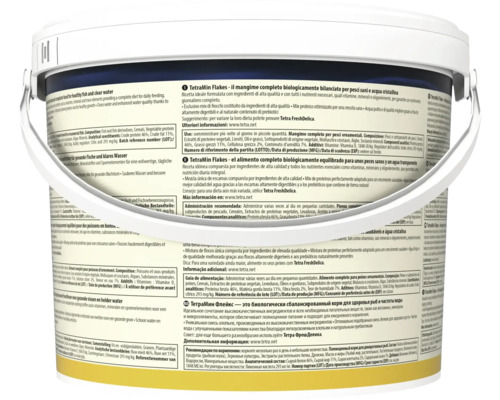 TetraMin Flakes Hauptfutter für Zierfische im großen weißen Eimer, Rückansicht mit detaillierten Produktinformationen in mehreren Sprachen.