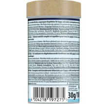 Rückseite einer Packung Fischfutter Mini Flakes für Guppys mit Inhaltsstoffen, Fütterungshinweisen und Barcode, 30 Gramm.