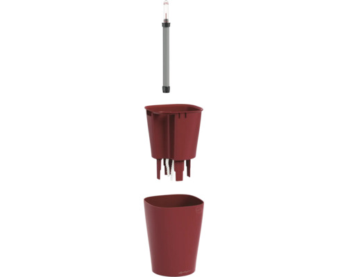 Dreiteiliges Lechuza Bewässerungssystem mit Wasserstandsanzeiger, Pflanzeinsatz inklusive Docht und einem roten Übertopf.