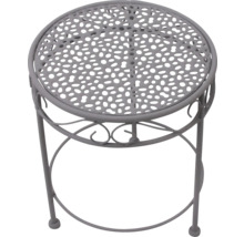 Runder Gartentisch aus Metall in Grau mit gelochter Tischplatte und dekorativen Verzierungen.