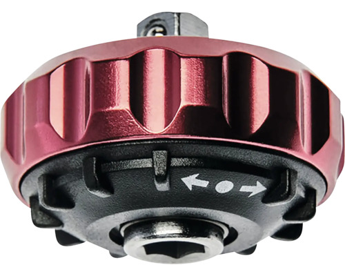 Rote Handknarre aus Metall mit schwarzem Sockel, geriffeltem Griff und Umschaltfunktion durch Pfeilsymbole.
