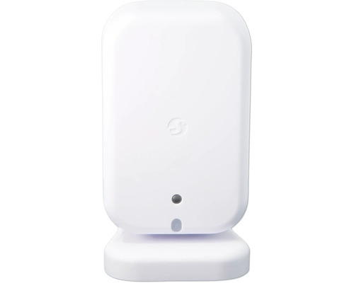 Weißes Somfy Smart Home Gerät mit abgerundeten Ecken, Standfuß, Somfy Logo und Anzeigeleuchten auf der Vorderseite.