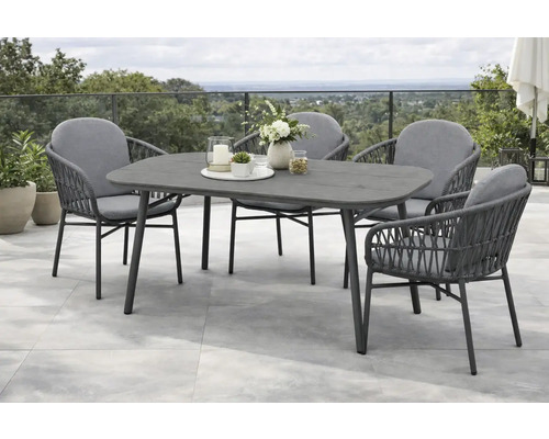 Modernes Gartenmöbel Set bestehend aus einem ovalen Esstisch und vier Sesseln mit Seilbespannung und Sitzkissen auf einer Terrasse.