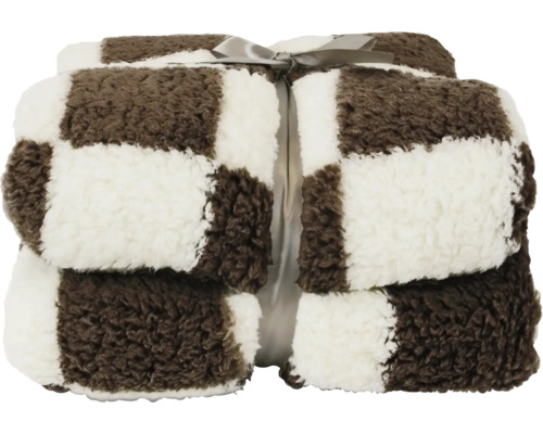 Gefaltete Kuscheldecke mit braun-weißem Karomuster und Schleife, weiches Teddy-Material.