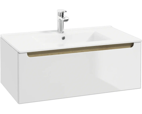 Waschtischunterschrank mit weißem Waschbecken, verchromter Armatur und einer Schublade mit Griffmulde in Holzoptik.