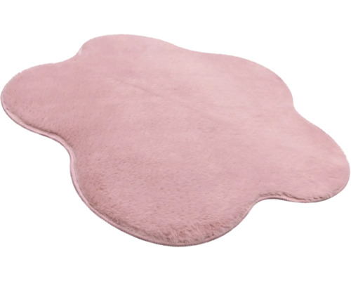 Rosa Kunstfellteppich in unregelmäßiger Wolkenform, weich und flauschig.