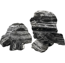 Mehrere dekorative Aquariumsteine mit markanter schwarz-weißer Streifung und natürlicher, rauer Textur in verschiedenen Größen.