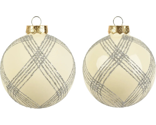 Weihnachtskugeln aus Glas in Creme mit silbernem Glitzer-Gittermuster und goldener Kappe.