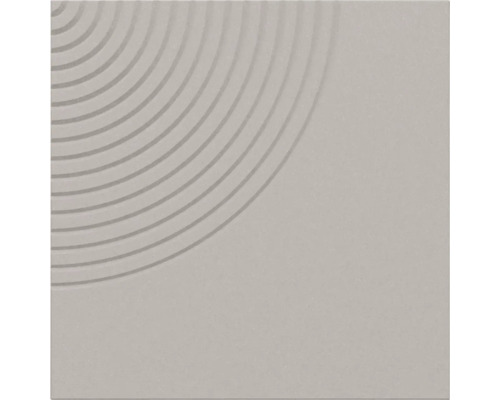 Quadratische graue Fliese mit strukturiertem geometrischem Muster aus konzentrischen Kreisrillen in einer Ecke.