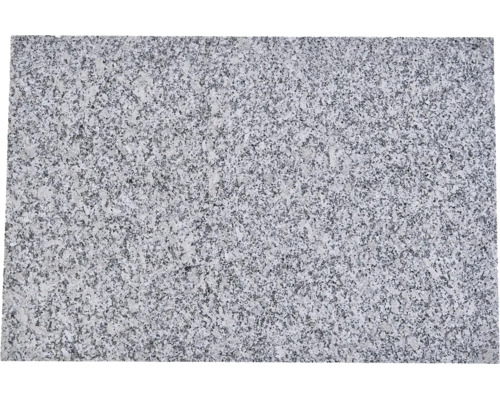 Granitplatte aus Naturstein mit gesprenkelter Oberflächenstruktur.