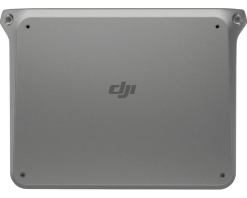 DJI Logo auf der Vorderseite einer flachen rechteckigen Drohnen Landestation mit Schrauben in den Ecken