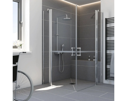 Barrierefreie Eckdusche mit Falttüren, Duschsystem mit Handbrause, bodengleiche Duschwanne und graue Fliesen in einem modernen Badezimmer.
