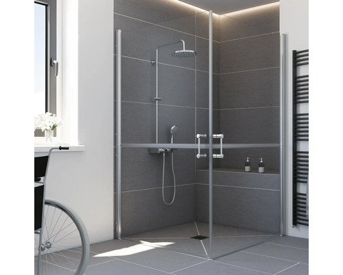 Barrierefreie Duschkabine mit geteilten Glastüren über Eck in einem modern gestalteten Badezimmer mit grauen Fliesen.